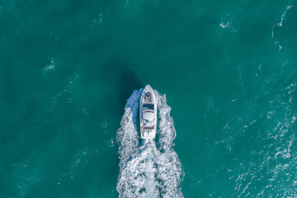 a small boat in the middle of the ocean