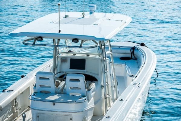 a small white boat in the water